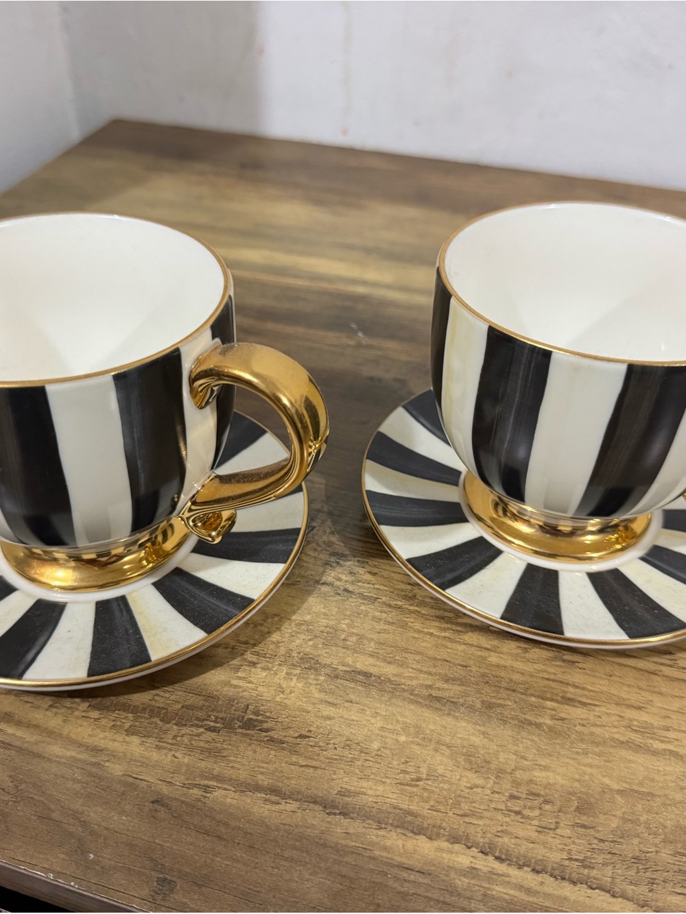 MacKenzie-Childs Black and White Striped Gold-Trim Teacup and Saucer Set pair